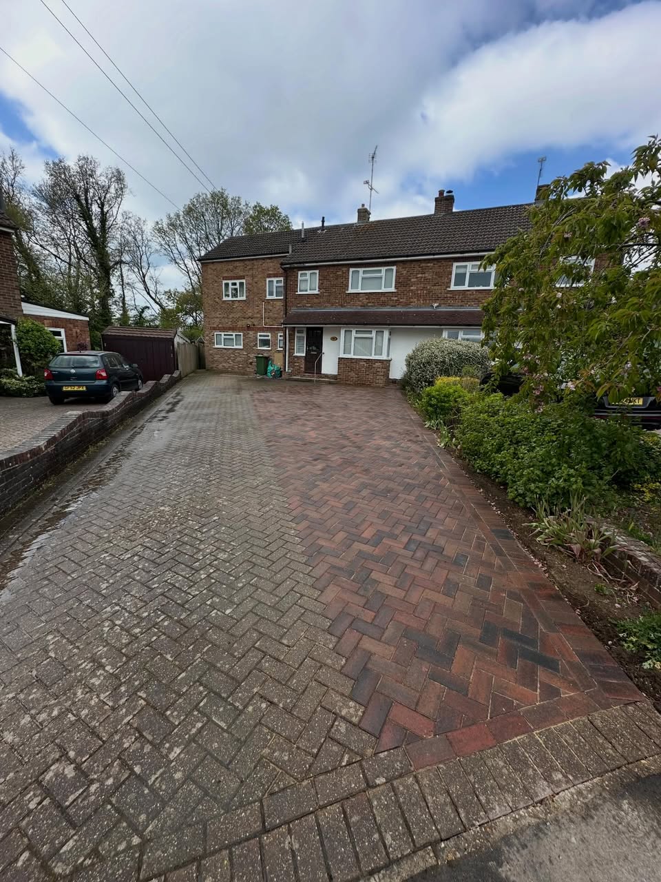 The same driveway after the work, with new brindle block paving