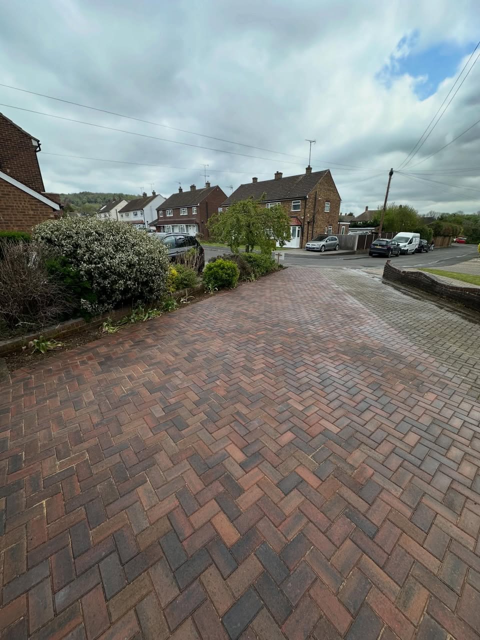 Newly laid brindle block paving driveway in herringbone pattern